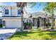 Charming two-story home featuring a landscaped yard and stone accents at 13722 Fox Glove St, Winter Garden, FL 34787
