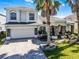 Beautiful home featuring a landscaped front yard, stone accents, and a two car garage at 13722 Fox Glove St, Winter Garden, FL 34787