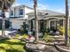 Beautiful home featuring landscaped front yard, stone accents and a columned porch at 13722 Fox Glove St, Winter Garden, FL 34787