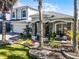 Beautiful home featuring landscaped front yard, stone accents and a columned porch at 13722 Fox Glove St, Winter Garden, FL 34787