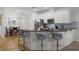 Kitchen featuring stainless steel appliances, white cabinets, and breakfast bar at 13722 Fox Glove St, Winter Garden, FL 34787