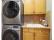 Laundry room with washer, dryer, sink and cabinet space at 13722 Fox Glove St, Winter Garden, FL 34787