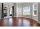 Bright living room with hardwood floors, French doors and multiple windows for great light at 13722 Fox Glove St, Winter Garden, FL 34787