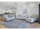 Bright living room features tile floors, modern lighting, and neutral-toned furniture for a cozy feel at 13722 Fox Glove St, Winter Garden, FL 34787