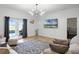Open living space filled with natural light showcases tile floors and backyard access through French doors at 13722 Fox Glove St, Winter Garden, FL 34787