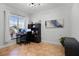 Bright office with a large window, built in desk setup, and tiled floor at 13722 Fox Glove St, Winter Garden, FL 34787