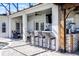 Outdoor kitchen with barstool seating featuring a built-in grill and space for entertaining guests poolside at 13722 Fox Glove St, Winter Garden, FL 34787