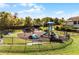 View of the playground featuring a slide, swings, and a climbing area at 13722 Fox Glove St, Winter Garden, FL 34787