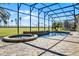 Backyard pool and spa surrounded by brick pavers within screened enclosure overlooking a large yard at 13722 Fox Glove St, Winter Garden, FL 34787