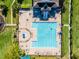 Aerial shot showcases the large community pool with ample seating and well-manicured landscaping at 13722 Fox Glove St, Winter Garden, FL 34787