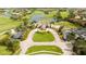 Expansive aerial view of the community clubhouse with manicured lawns, ample parking, and serene surroundings at 14040 Helsby St, Orlando, FL 32832