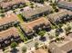 Aerial view of townhome highlighting roof, curb appeal, and surrounding neighborhood layout at 14040 Helsby St, Orlando, FL 32832