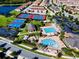 High-angle view of community amenities including tennis courts, basketball courts, pools, and gathering areas at 14040 Helsby St, Orlando, FL 32832