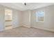 Bedroom with a tray ceiling, carpet flooring and an ensuite bathroom at 14040 Helsby St, Orlando, FL 32832