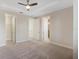 Bedroom with carpet flooring, ceiling fan, and ensuite bathroom at 14040 Helsby St, Orlando, FL 32832