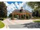 Community gate with stone accents, providing security and controlled access for residents and visitors at 14040 Helsby St, Orlando, FL 32832