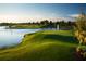 Picturesque golf course view featuring a water fountain feature and lush green fairways and serene blue water at 14040 Helsby St, Orlando, FL 32832