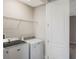 Laundry room showcasing a washer and dryer with ample shelving space for storage at 14040 Helsby St, Orlando, FL 32832