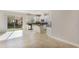 Kitchen area with granite countertops and white cabinets opens up into a spacious living and dining area at 14040 Helsby St, Orlando, FL 32832