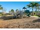 Community playground featuring modern equipment, a secure surface, and beautiful landscaping, creating a safe play space at 14040 Helsby St, Orlando, FL 32832