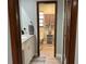 Bathroom view featuring a marble vanity and tiled floors and neutral decor at 1500 Markham Woods Rd, Longwood, FL 32779