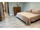 Comfortable bedroom with neutral decor, tile floor, and a calm feel at 1500 Markham Woods Rd, Longwood, FL 32779