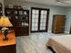 Cozy bedroom with french doors, plenty of closet space, and neutral decor at 1500 Markham Woods Rd, Longwood, FL 32779