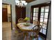 Charming dining area with wood table and chairs next to the kitchen at 1500 Markham Woods Rd, Longwood, FL 32779