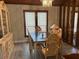 Dining room featuring a decorative chandelier and wood floors at 1500 Markham Woods Rd, Longwood, FL 32779