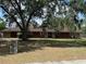 Charming single-story home with a well-maintained lawn and mature trees offering plenty of shade at 1500 Markham Woods Rd, Longwood, FL 32779