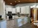 Bright kitchen with stainless steel appliances and white cabinets at 1500 Markham Woods Rd, Longwood, FL 32779