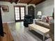 Cozy living room featuring wood ceilings and plenty of natural light at 1500 Markham Woods Rd, Longwood, FL 32779
