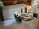 Bright living room with a stone fireplace and light colored floors at 1500 Markham Woods Rd, Longwood, FL 32779