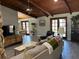 Inviting living room with wood ceilings, tile floors and comfortable seating area at 1500 Markham Woods Rd, Longwood, FL 32779
