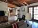Inviting living room with natural light, cozy seating, and access to the outdoors at 1500 Markham Woods Rd, Longwood, FL 32779