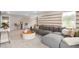 Spacious living room with comfortable gray sectional sofa, plush carpeting, and stylish decor at 15446 Orchard Garden St, Winter Garden, FL 34787