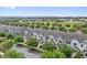 Community aerial view showcases landscaped grounds, nearby homes, and tranquil surroundings at 15456 Blackbead St, Winter Garden, FL 34787