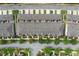 An overhead view displaying the rooflines of townhomes, with private back patios and orderly street parking at 15456 Blackbead St, Winter Garden, FL 34787