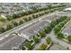 Aerial view showcasing well-maintained townhomes, lush trees, and convenient street parking in a desirable neighborhood at 15456 Blackbead St, Winter Garden, FL 34787