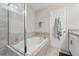 This bathroom features a relaxing soaking tub and updated fixtures at 15456 Blackbead St, Winter Garden, FL 34787