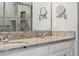 The primary bath includes granite countertops, double sinks, and updated fixtures at 15456 Blackbead St, Winter Garden, FL 34787