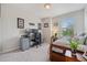 Comfortable bedroom with neutral colors, an office space, and natural light at 15456 Blackbead St, Winter Garden, FL 34787