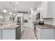 Bright kitchen featuring granite countertops, stainless steel appliances, and tiled floors at 15456 Blackbead St, Winter Garden, FL 34787