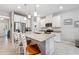 Elegant kitchen with granite island, stainless appliances, and white cabinetry at 15456 Blackbead St, Winter Garden, FL 34787