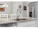 The stainless steel faucet over a granite countertop island sink at 15456 Blackbead St, Winter Garden, FL 34787