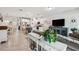 Open floor plan featuring a living room, dining area, and kitchen with white cabinetry at 15456 Blackbead St, Winter Garden, FL 34787