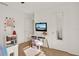 Bright bedroom featuring a modern desk, a mirror, and stylish decor at 1579 Swan Lake Cir, Dundee, FL 33838