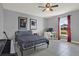 Cozy bedroom with a window, musical instruments, and two portraits at 1579 Swan Lake Cir, Dundee, FL 33838