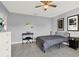 Clean bedroom with musical instruments, a ceiling fan, and simple decor at 1579 Swan Lake Cir, Dundee, FL 33838