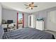 Bedroom with ceiling fan, desk, closet, and window with outside view for a bright, welcoming space at 1579 Swan Lake Cir, Dundee, FL 33838
